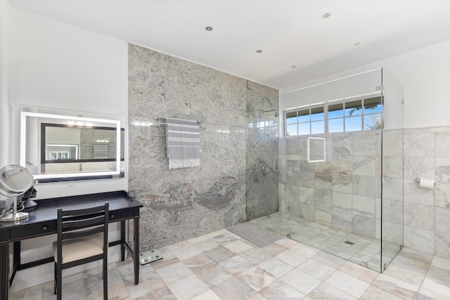 bathroom with a walk in shower and tile walls