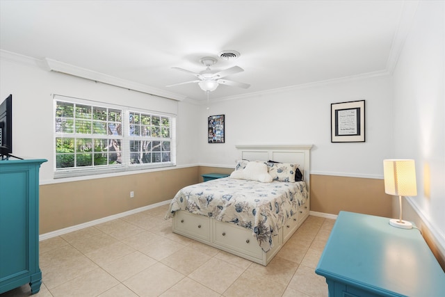 bedroom featuring light tile patterned floors, visible vents, baseboards, a ceiling fan, and crown molding