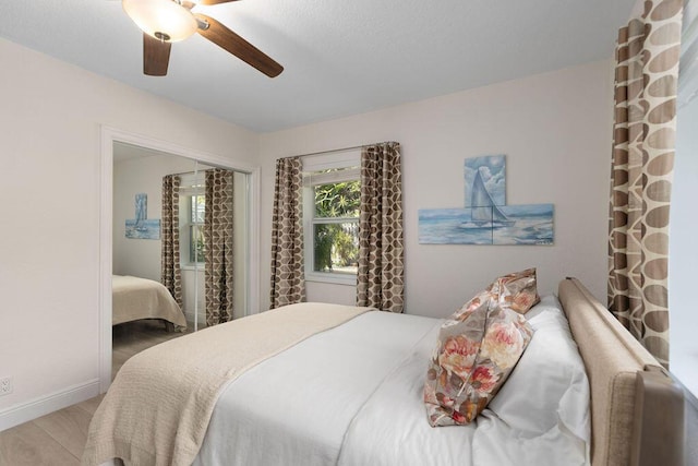 bedroom featuring hardwood / wood-style floors and ceiling fan