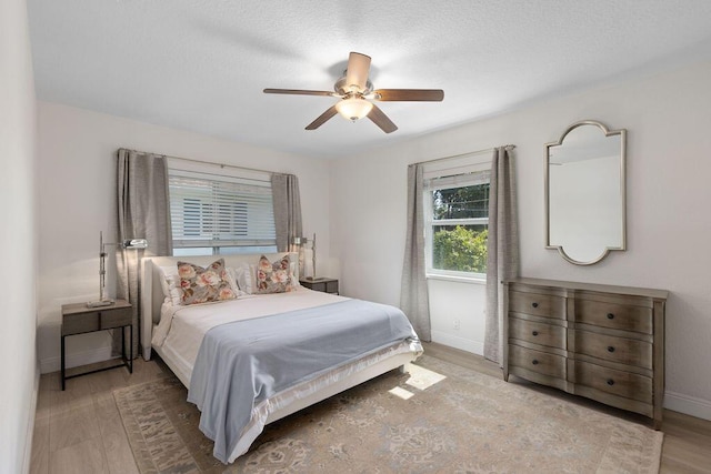 bedroom featuring hardwood / wood-style flooring and ceiling fan