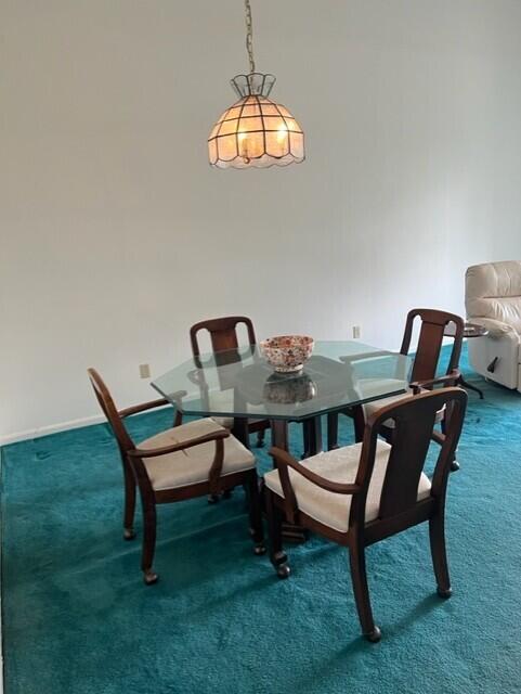 dining area featuring carpet flooring