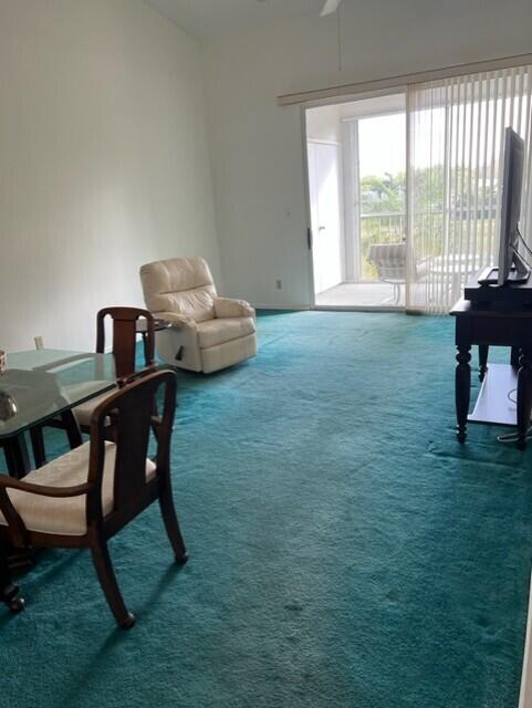 sitting room featuring carpet floors