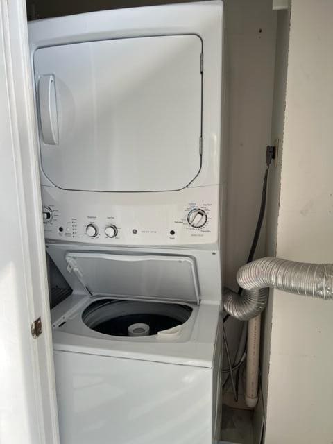 laundry area featuring stacked washer / dryer