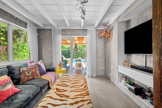 tiled living room featuring beam ceiling