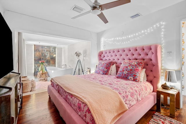 bedroom featuring dark wood-type flooring and ceiling fan