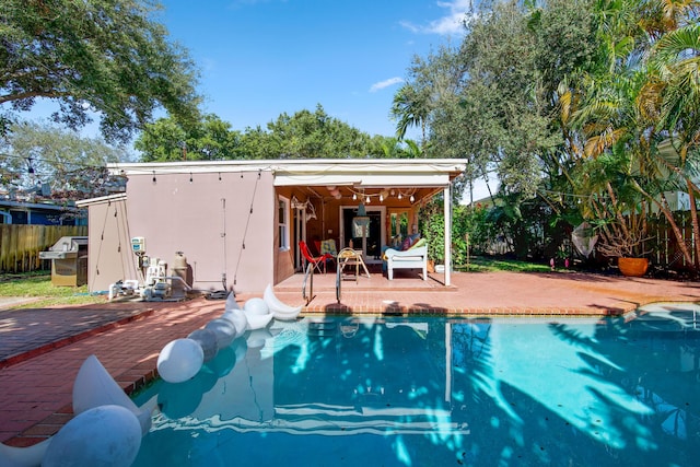 view of swimming pool with a patio area