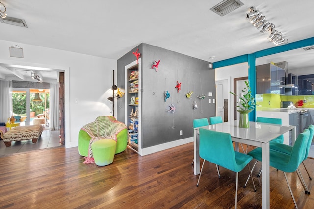 dining room featuring dark wood-type flooring