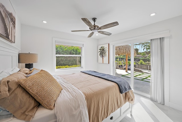 bedroom featuring multiple windows, access to outside, and ceiling fan