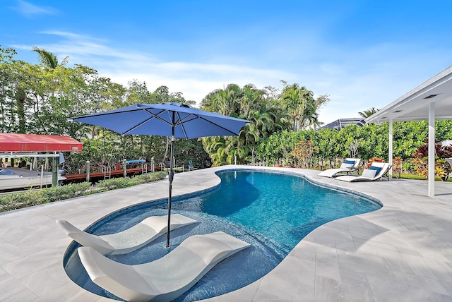 outdoor pool with a patio