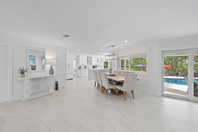 dining room with crown molding, marble finish floor, baseboards, visible vents, and recessed lighting