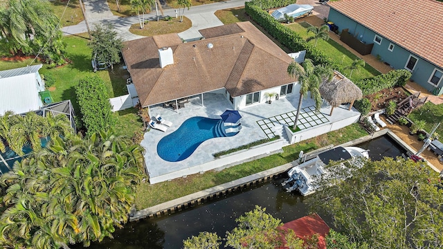 birds eye view of property with a water view
