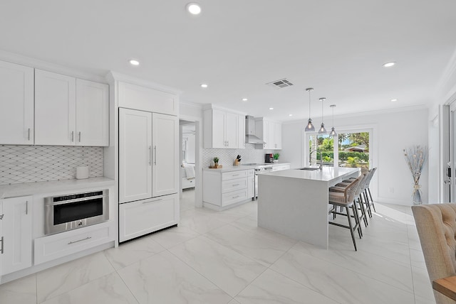 kitchen with marble finish floor, wall chimney range hood, visible vents, decorative backsplash, and electric range