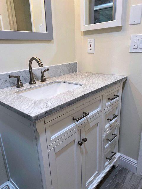 bathroom featuring vanity and baseboards