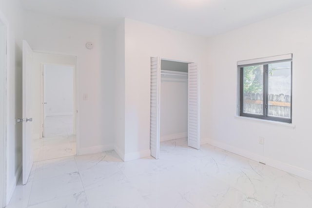 unfurnished bedroom featuring a closet