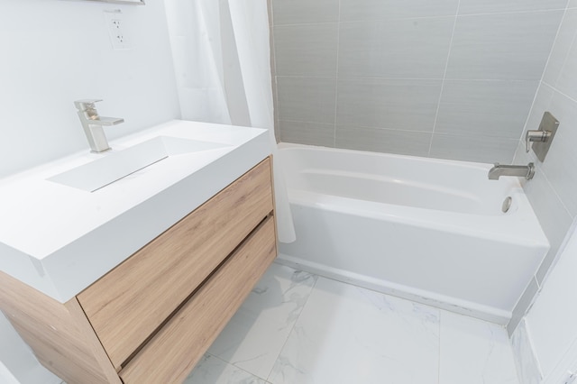 bathroom featuring vanity and washtub / shower combination