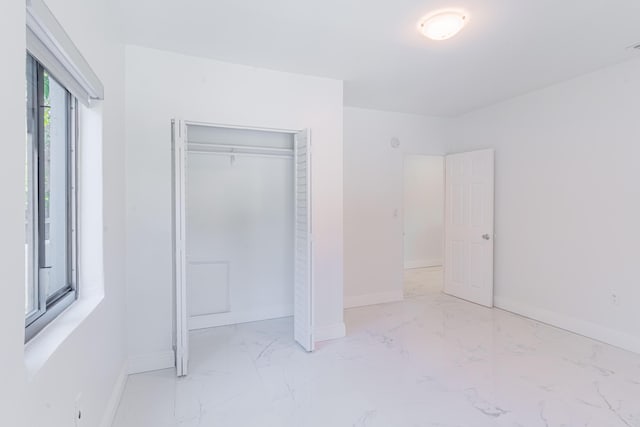 unfurnished bedroom featuring a closet