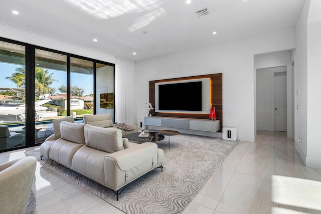 living room featuring visible vents, recessed lighting, and baseboards