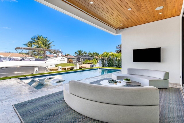 outdoor pool featuring a patio and outdoor lounge area