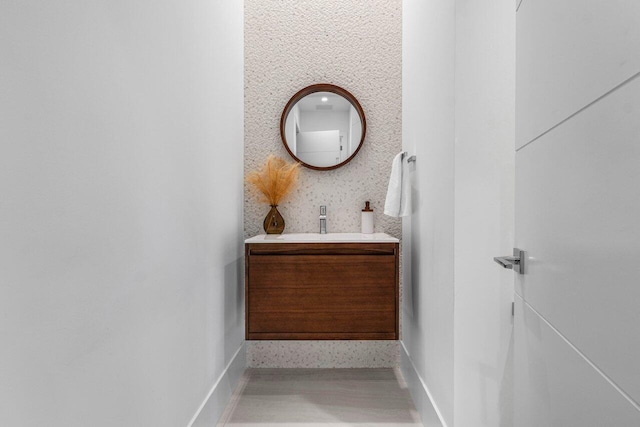 bathroom featuring vanity and baseboards