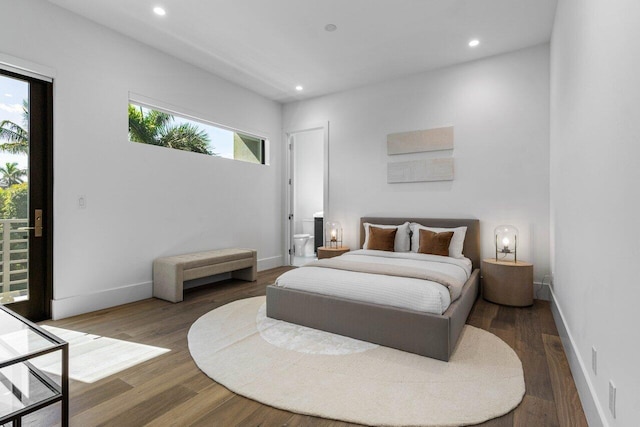 bedroom featuring recessed lighting, baseboards, wood finished floors, and access to exterior