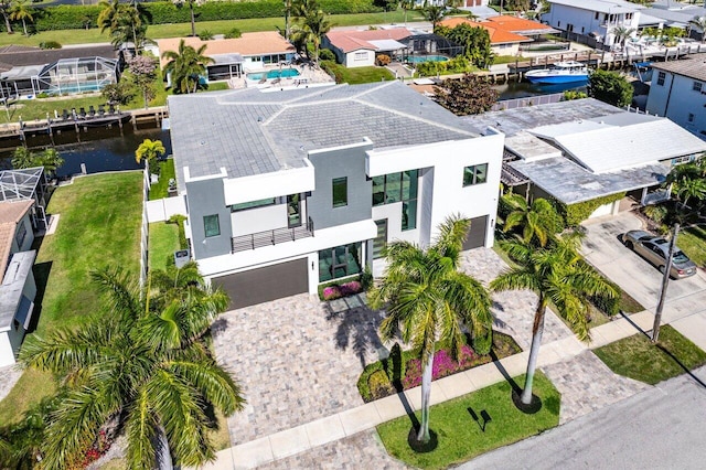 birds eye view of property featuring a residential view and a water view