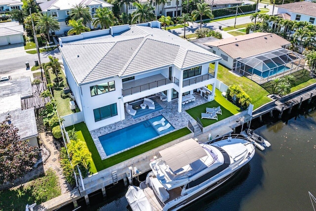 aerial view with a residential view and a water view