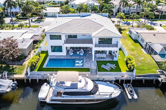 bird's eye view featuring a residential view and a water view