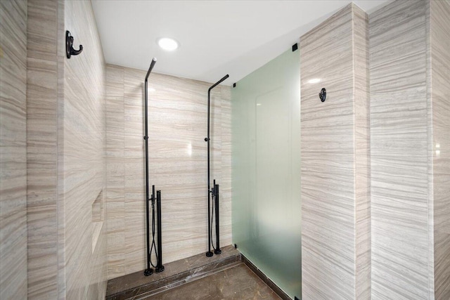 bathroom with tiled shower