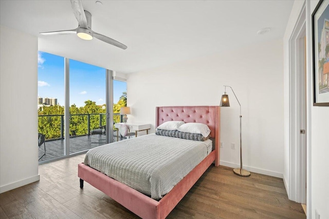 bedroom with expansive windows, ceiling fan, access to outside, and dark hardwood / wood-style flooring