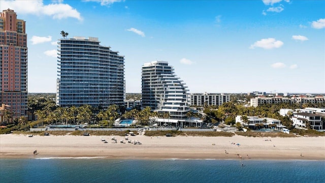 bird's eye view with a view of the beach and a water view