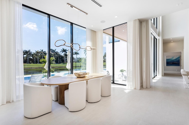 dining room featuring a wall of windows