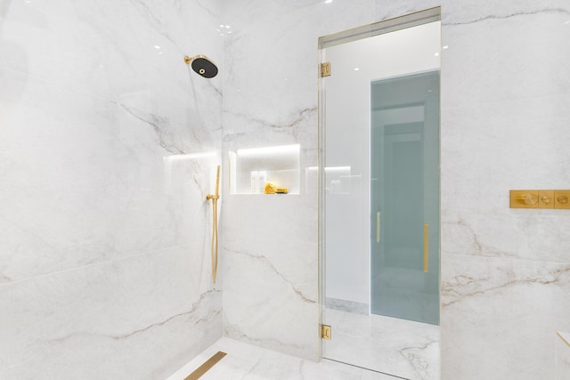 bathroom with a marble finish shower