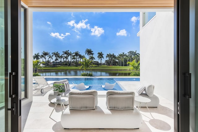 view of pool featuring a water view