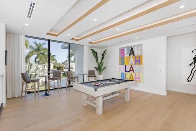 game room with baseboards, pool table, light wood-type flooring, and floor to ceiling windows