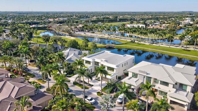 birds eye view of property featuring a water view and a residential view