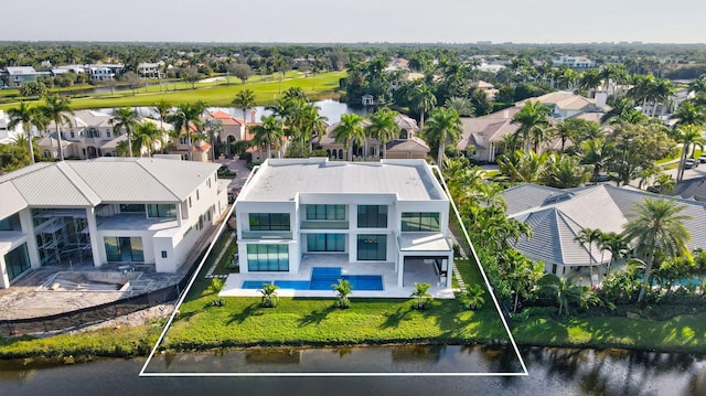 drone / aerial view featuring a residential view and a water view