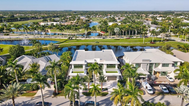 drone / aerial view featuring a water view and a residential view