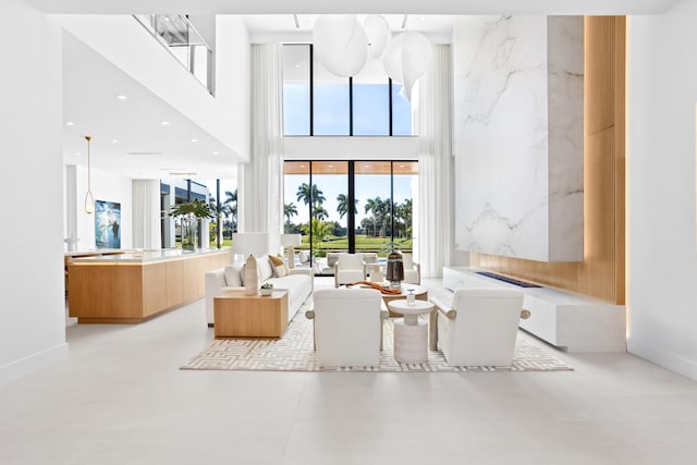 living room with a high ceiling and recessed lighting