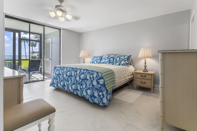 bedroom with floor to ceiling windows, access to exterior, and ceiling fan