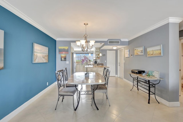 dining room with crown molding and a chandelier