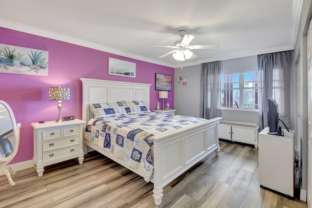 bedroom featuring crown molding, ceiling fan, and light hardwood / wood-style flooring