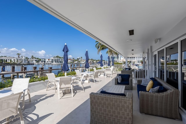 view of patio with a water view