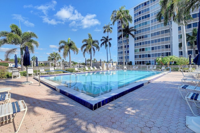 view of swimming pool with a patio area