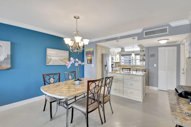 tiled dining area with an inviting chandelier and ornamental molding