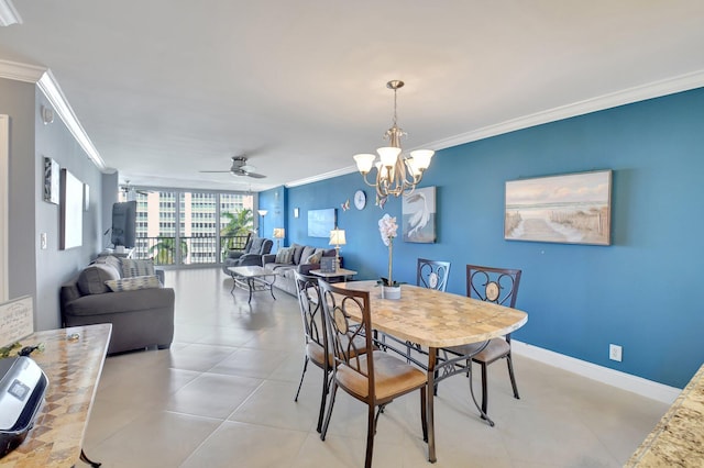 tiled dining space featuring ornamental molding, floor to ceiling windows, and ceiling fan with notable chandelier