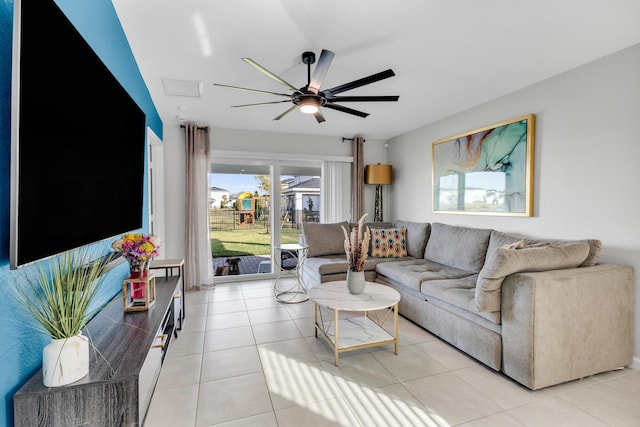 living room featuring ceiling fan and light tile patterned floors