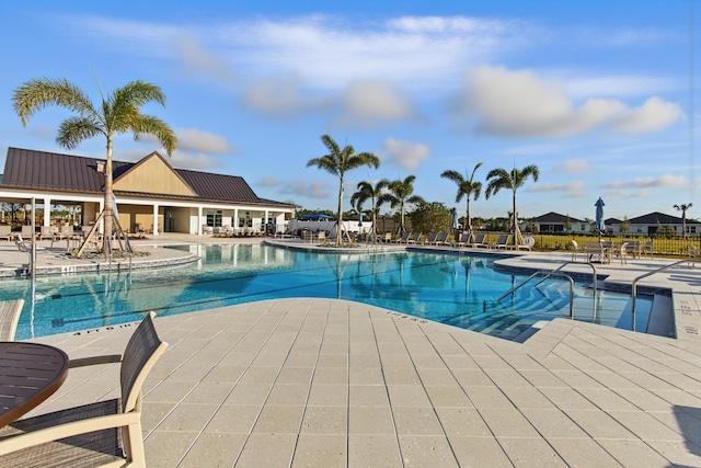 view of swimming pool featuring a patio area