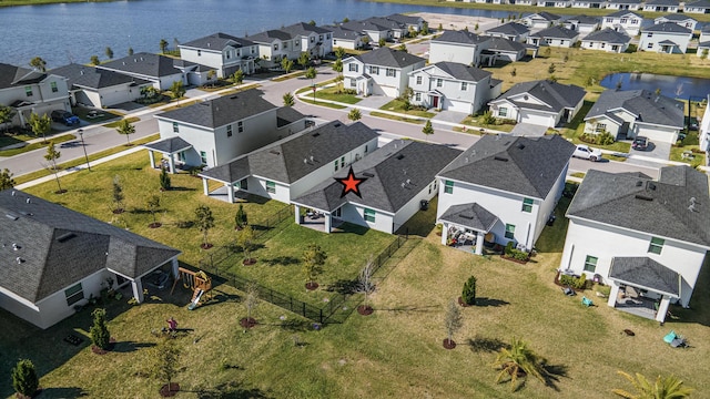 drone / aerial view featuring a water view