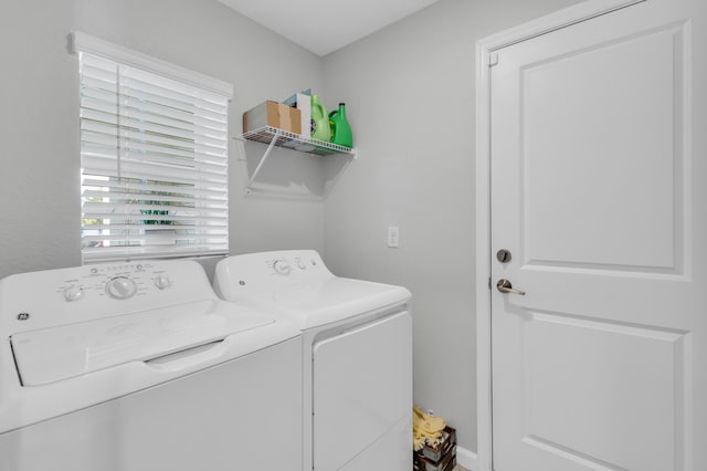 laundry room with washing machine and dryer