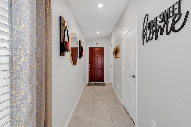 corridor featuring light tile patterned floors